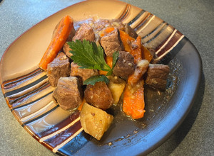 A picture of Garlic steak bites (w/potatoes and carrots).