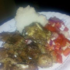 A picture of Fried beef with kachumbari and ugali.
