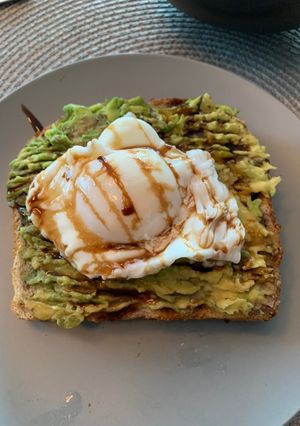 A picture of Avocado 🥑 + Poached Egg 🥚 Sourdough Toast.