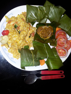 A picture of Fish in Banana leaves.