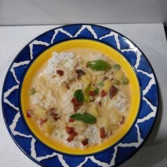 A picture of Iddiyapam with Vegetable stew.