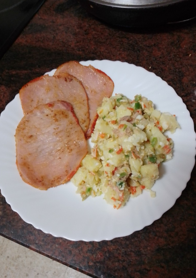 Una foto de Lomo adobado con papas aliñadas