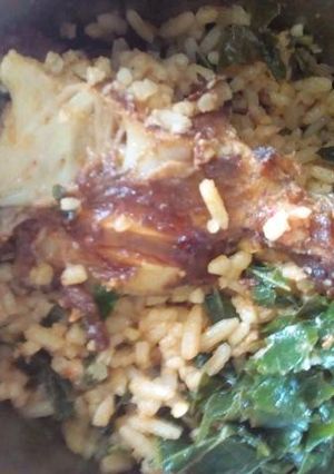 A picture of Jallof rice and pumpkin leaf.