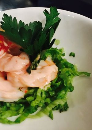 A picture of Prawns with white sauce.