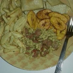 A picture of Fried yam, chips, fried plantain n egg n sausage sauce.