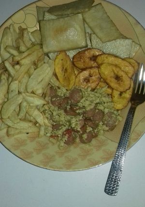 A picture of Fried yam, chips, fried plantain n egg n sausage sauce.