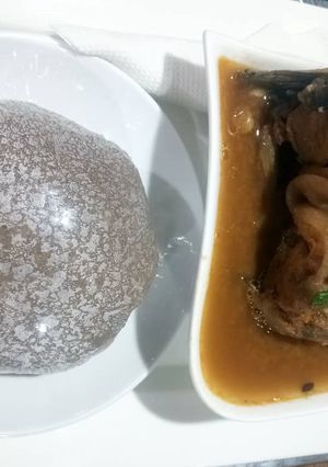 A picture of Amala with catfish peppersoup.