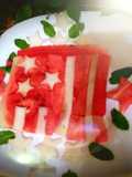 Red yellow melon dessert in the shape of a flag