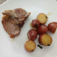 Minted red russet potatoes with grilled lamb A picture of Minted red russet potatoes with grilled lamb.