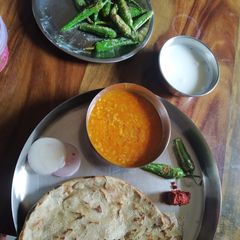 A picture of Urad Daal and Bajri Roti.