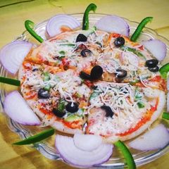 A picture of Brown Rice Uttappam Pizza.