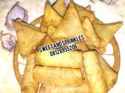 A picture of samosa and spring rolls