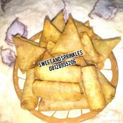 Samosa and Spring rolls A picture of Samosa and Spring rolls.