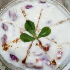 Raita with tomato and onion A picture of Raita with tomato and onion.