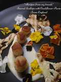 Seared scallops with cauliflower puree, chargrilled cauliflower and edible flowers