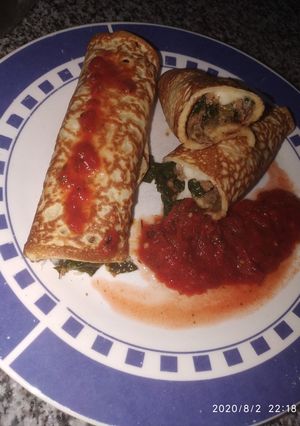 Una foto de Canelones de espinaca y carne