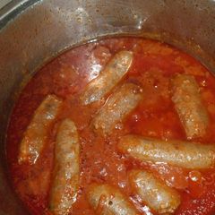 A picture of Boerewors in tomato gravy.