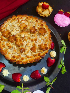 A picture of Apple pie with strawberry cream.