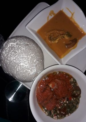 A picture of Tuwo shinkafa, beans soup, okro and stew.