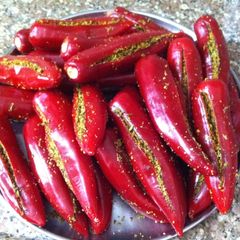 A picture of Stuffed red chillies.