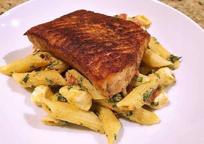 Blackened salmon over smokey mozzarella pasta