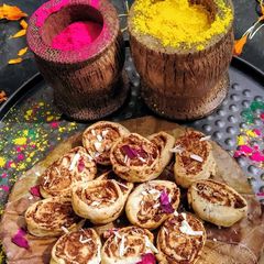 A picture of Thandai flavored gujiya bites.