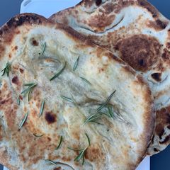 A picture of Garlic and rosemary naan bread.