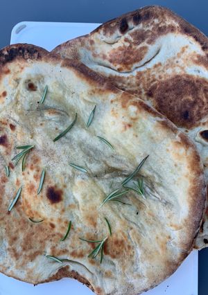 A picture of Garlic and rosemary naan bread.