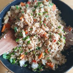 A picture of Stir fried rice with eggs and vegetables.