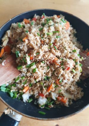 A picture of Stir fried rice with eggs and vegetables.