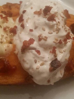A picture of Sesame Baked Sweet Potatoes w/ Roasted Garlic Sour Cream.