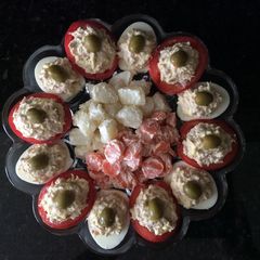 A picture of Stuffed Tomatoes and Deviled Eggs.