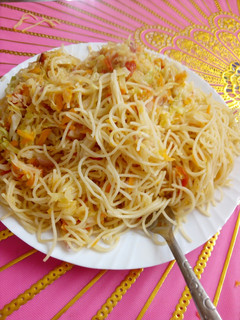 A picture of Spaghetti with steamed cabbage.
