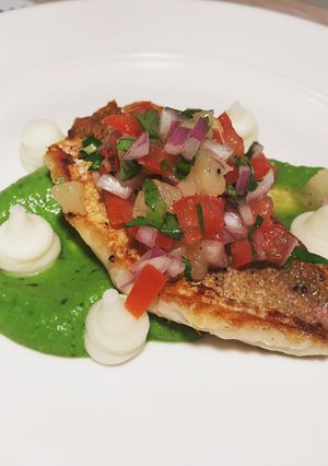 A picture of Pan fried fish with pineapple salsa.