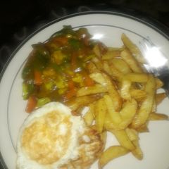 A picture of Chips & Veggies in gravy sauce.