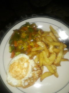 A picture of Chips & Veggies in gravy sauce.