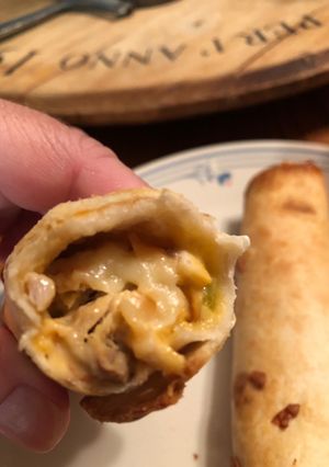A picture of Chicken and cheese taquitos.