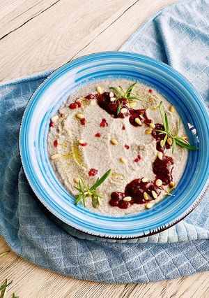 A picture of Cauliflower soup with raspberry sauce and truffle oil 🤤.