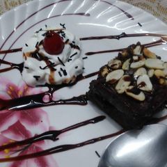 A picture of Chocolate and peanut fudge brownie.