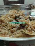 Arroz con caracoles y moluscos