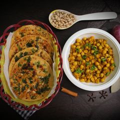 A picture of Chole with wheat kulcha.