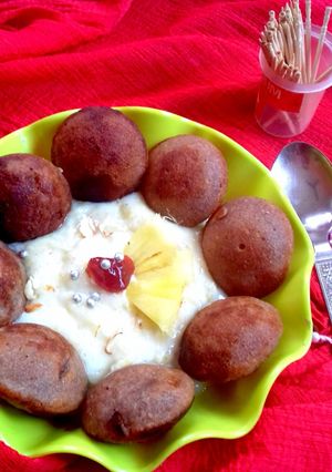 A picture of Choco paniyaram with pineapple rabdi.