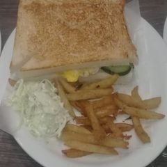 A picture of Sandwich with fries.