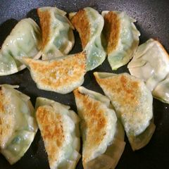 A picture of Gyoza style seafood dumplings.
