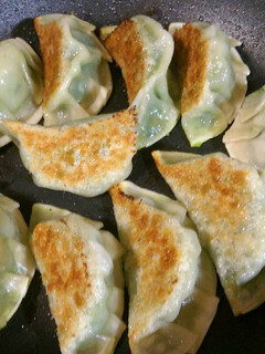 A picture of Gyoza style seafood dumplings.