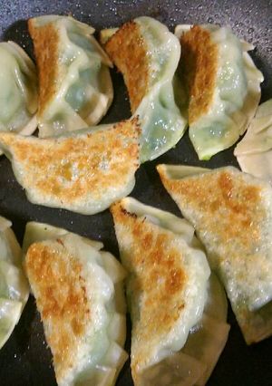 A picture of Gyoza style seafood dumplings.