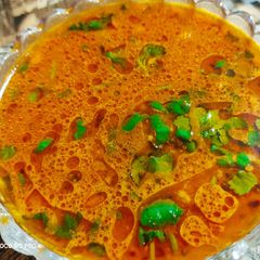A picture of Garlic Tomato Rasam.