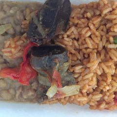 A picture of Jollof rice with porriage beans.