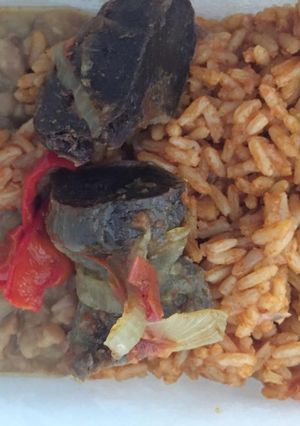 A picture of Jollof rice with porriage beans.