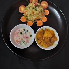 A picture of Fried rice doi potato raita and salad.